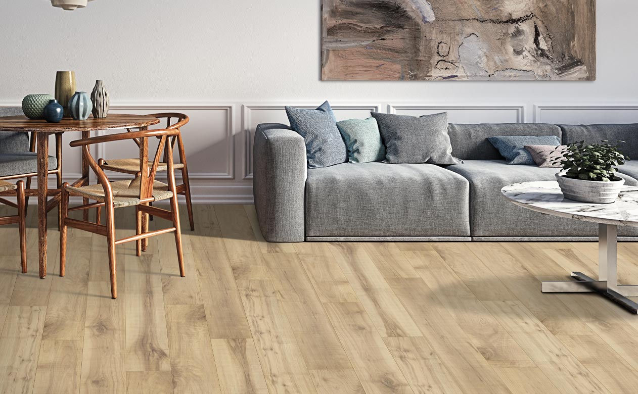 wood look laminate flooring in living room with grey couch and dining table